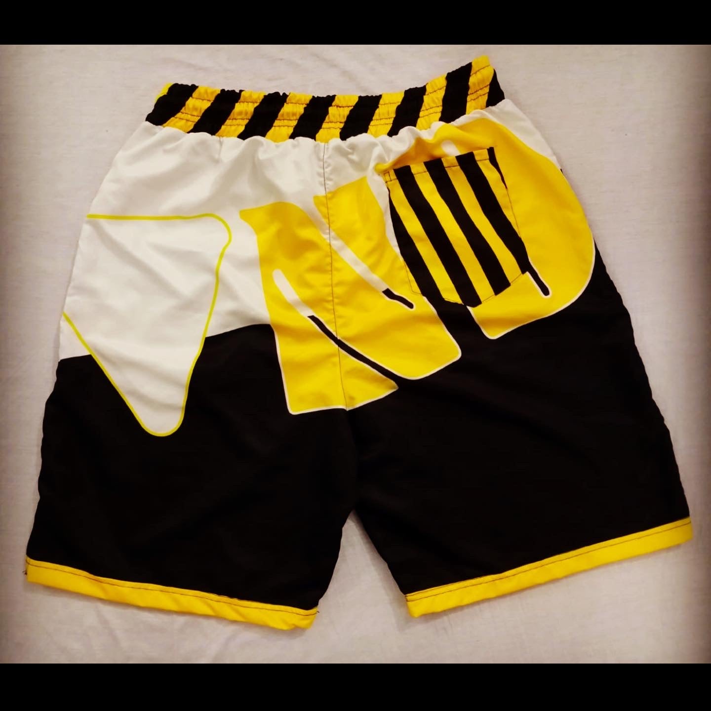 "BRAND" Caution swim shorts